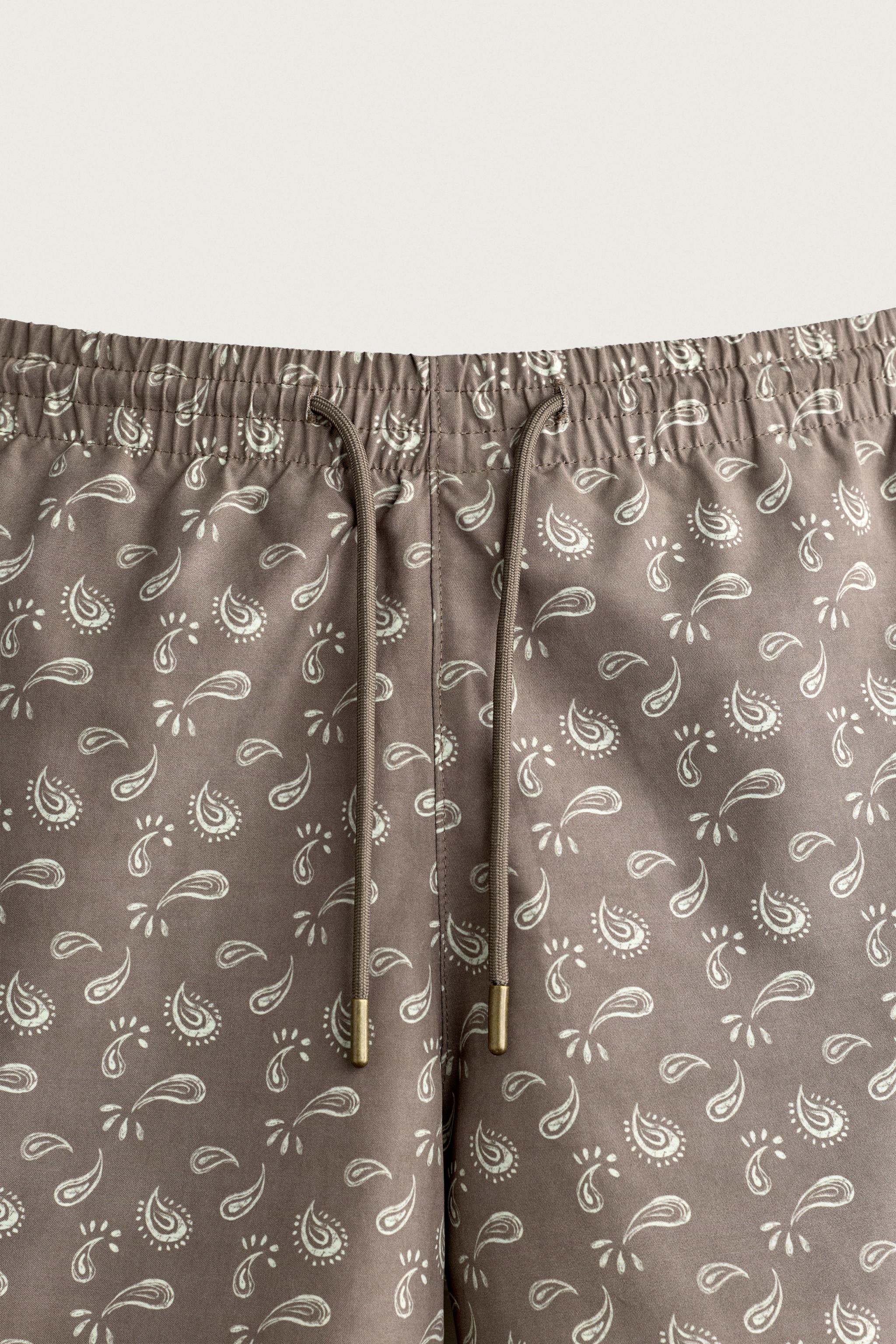 PAISLEY PRINT MID-LENGTH SWIM TRUNKS